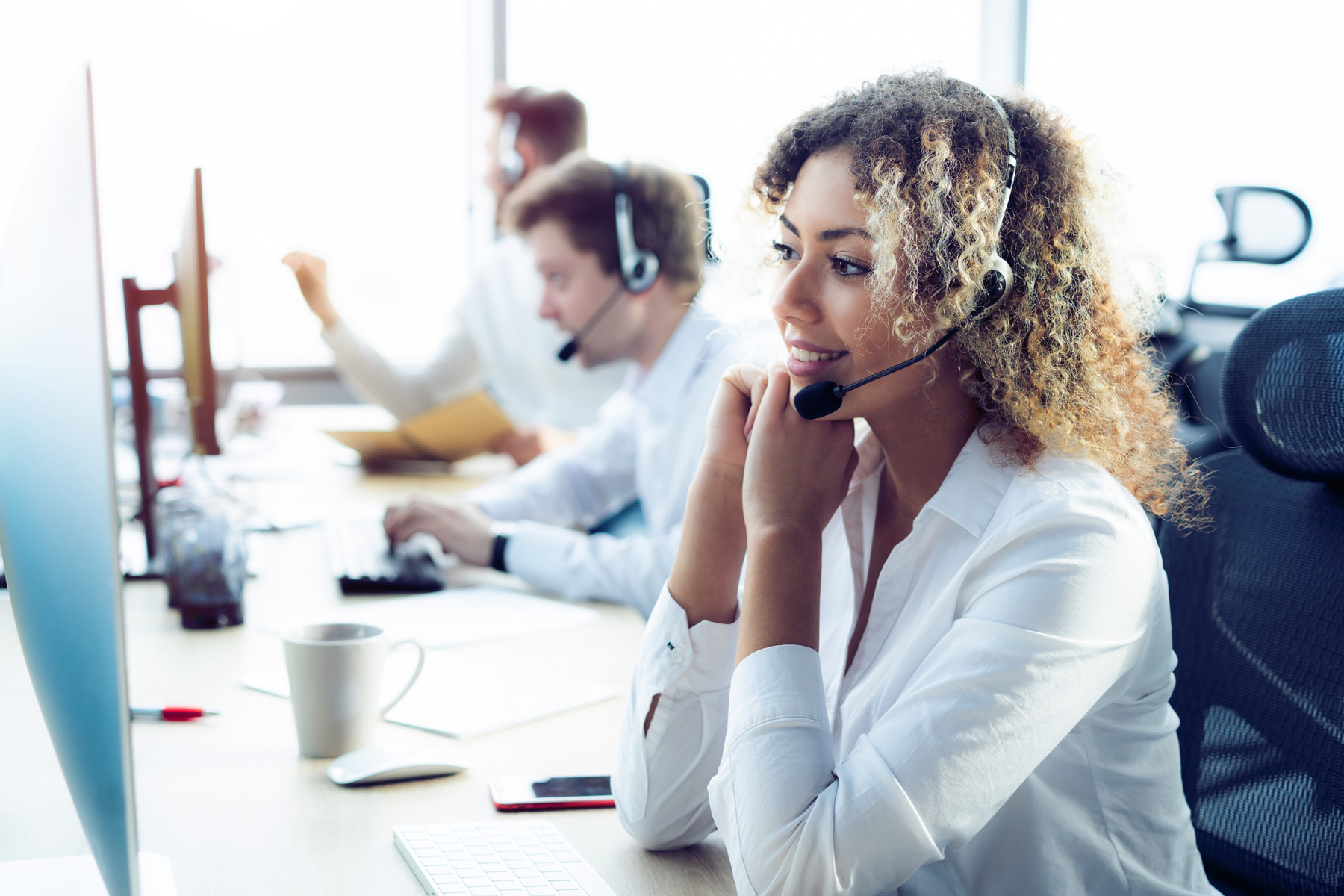 Female Customer Support Operator with Headset and Smiling